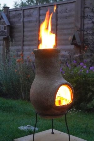 chiminea with flames out top