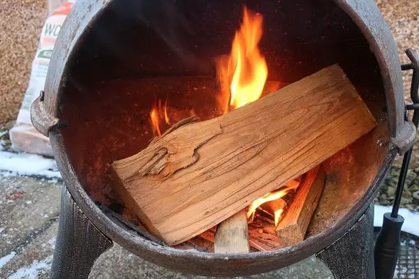 put first log on chiminea fire