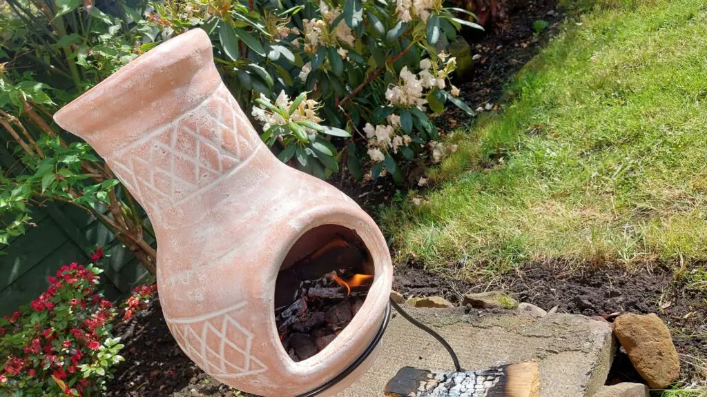 clay chiminea bunring logs without smoke